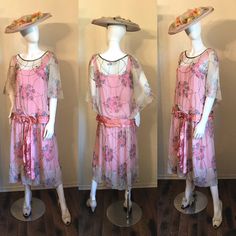 "Here is a beautiful 1920's Floral silk chiffon dress. Such a pretty one in shades of pink. The silk chiffon is an off white color with the floral, print in shades of pinks, blue and yellow. It has the gorgeous bugle beading with the cape like over sleeves, drop waist and pink satin belt with bow. The under slip dress is attached and is a bright pink silk sateen with drawstring at bust. There are side snaps in the chiffon, under slip has no openings. It is in good condition for this age and type Vintage Summer Flapper Dress For Wedding, 1920s Style Summer Flapper Dress, 1920s Style Spring Evening Dresses, 1920s Style Dresses For Vintage Summer Events, 1920s Style Summer Dresses For Vintage Events, Vintage Summer Evening Flapper Dress, 1920s Style Flapper Dress For Spring Party, Summer Gatsby Style Flapper Dress For Vintage Events, Summer Vintage Flapper Dress For Vintage Events