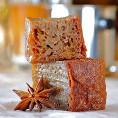 two pieces of soap sitting on top of each other next to anisette and star anise