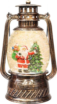 a snow globe with santa clause and christmas trees in it's glass dome holder