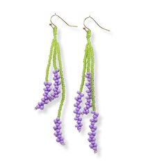 purple and green beaded earrings on white background