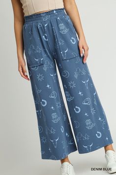 our french terry wide leg elastic waistband pants with graphic print & side pockets! who says style and comfort can't coexist? get ready to kick back and relax in these wide leg pants, complete with an elastic waistband (for indulging in all the snacks). plus, with a graphic print and handy side pockets, you'll be looking and feeling like a fashionista.shop our matching set, french terry graphic printed top!fabric contents & fit notes:• model is 5'9" and is wearing a small.• all measurements are Cotton Wide Leg Pants With Side Pockets For Loungewear, Comfortable Cotton Wide Leg Pants With Elastic Waistband, Trendy Graphic Print Relaxed Fit Pants, Trendy Cotton Bottoms With Graphic Print, Trendy Graphic Print Cotton Bottoms, Graphic Print Pants For Summer Loungewear, Casual Printed Cotton Bottoms, Casual Cotton Printed Bottoms, Summer Graphic Print Pants For Loungewear