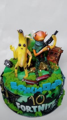 a birthday cake decorated to look like an animated movie character with two characters on top