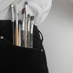 there are many brushes in the pocket of someone's pants