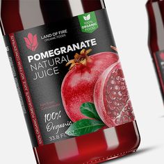 two bottles of pomegranate juice on a white background