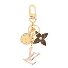 louis vuitton key chain with flower and butterfly charms on the front, gold plated