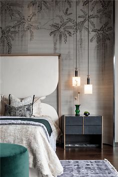 a bedroom with a bed, night stand and rug