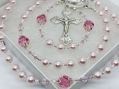 *Finest European pearls and crystals make up this stunning sparkly rosary.  Soft pink pearls make up the Hail Mary Beads surrounded by crystal pink Our Father Beads and crystal bicone beads.  CENTERPIECES You may choose a centerpiece to personalize your rosary at checkout.  The centerpieces are silver plated and made in Italy. CRUCIFIXES May vary depending on availability.  Crucifixes are silver plated and made in Italy. PERSONALIZATION If you desire personalization, the name or initials will be blended in the 3rd decade of this rosary using round pewter letter beads.  Initials may also be added to the tail of the rosary. We chose these letter beads because they add a personal touch, but do not overtake the design of the rosary. *We use the strongest jewelry wire, crimp beads and wire guar Mothers Daughter, Saying The Rosary, Rosary Making, Catholic Images, Pink Pearls, Crimp Beads, Our Father, Hail Mary, Rosary Catholic