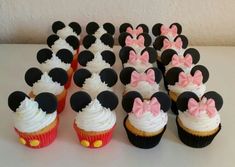 there are many cupcakes with minnie mouse ears on them