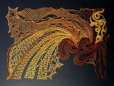 a piece of art that is made out of wire and gold thread on a black background