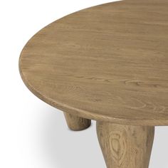 a round wooden table with two legs on the top and one leg extended to the side