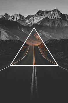 an image of a road with mountains in the background and a white triangle over it