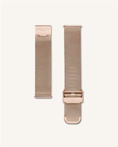 the gold watch strap is attached to an apple watch band with a metal buckle and clasp