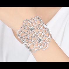 Stunning Silver Tone Crystal Rhinestone Bracelet Features A Lobster Clasp For Ease In Wearing. Can Be Worn With A Wedding Dress, Little Black Dress Or With Your Favorite Jeans. The Intricate Details In This Design Will Help Complete Your Ensemble. White Crystal Party Bracelet, Silver Crystal Bracelet With Rhinestones, White Crystal Bracelet With Bling, Elegant White Crystal Bracelet With Sparkling Stones, Elegant Diamond White Crystal Bracelet For Party, Elegant White Crystal Bracelet, White Crystal Bracelet With Sparkling Stones, Diamond White Crystal Bracelet For Party, White Crystal Bracelet With Rhinestones For Party