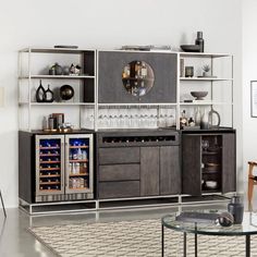 a living room with a wine cooler and shelves