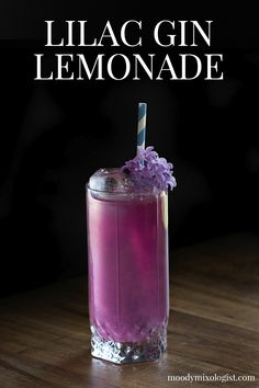 lilac gin lemonade in a tall glass with a straw garnish on the rim