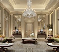 an elegant living room with chandelier, couches and tables in the center