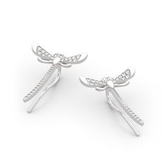 These sterling silver dragonfly earrings are symbolic of a lighter and brighter outlook on life - reminding us to live life to the fullest. This piece is undeniably shimmering and powerfully eye-catching - a dragonfly weaving through an earlobe is rarely seen! They make a delicate and meaningful gift for a loved one. Love life with our cute dragonfly climber earrings!Carat Weight: 0.748 ctStone Size: 1,1.2,1.3 mmStone Type: Jeulia® StoneNumber of Stones: 64 Stone Shape: RoundStone Color: Diamond Elegant Sterling Silver Dragonfly Earrings, Elegant Dragonfly Earrings With Ear Wire, Elegant Dragonfly Jewelry With Ear Wire, Cute Dragonfly, Live Life To The Fullest, Dragonfly Earrings, Climber Earrings, One Love, Gifts For My Sister