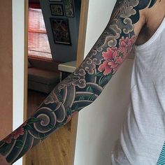 a man with a tattoo on his arm