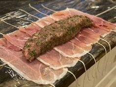 raw meats are wrapped in plastic on the counter