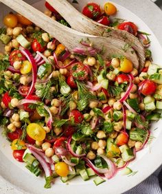 a white bowl filled with lots of different types of vegetables and garnishes