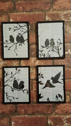 three framed birds sitting on top of a tree branch