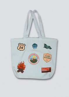 Meet your new go-to accessory for the desert getaway: the Camp Poosh x Coney Island Picnic Tote Bag. Dyed in a soft, soothing baby blue hue and garment washed for a touch of laid-back charm, this tote is as stylish as it is practical. Adorned with screenprinted patches all over, each patch tells a story of adventure and relaxation. Whether you're strolling through the palm-lined pathways of Camp Poosh or exploring the vibrant streets of the city, this tote is the perfect companion for carrying y Camp Poosh, Desert Getaway, Camping Tote, Picnic Tote, Bag Patches, Soothing Baby, Shopping Totes, Coney Island, Camping Shirt