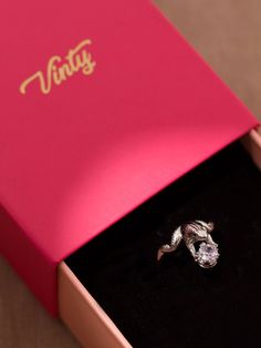 Surprise your loved one with a meaningful frog ring with a unique design. Available in 22k gold plating or platinum plating, it is a delightful piece that will mark your love story. Crafted from brass with an adjustable ring band, it is an excellent choice if you are looking for a distinctive design. The aesthetics feature a frog holding a crown adorned with sparkly cubic zirconia. It is an ideal option if you are looking for a cubic zirconia engagement ring that stands out among the rest. Amaze Couple Rings Open Ring With Prong Setting, White Gold Crystal Toe Ring As Gift, White Gold Crystal Toe Ring For Gift, Cubic Zirconia Wedding Ring As Gift, Adjustable Fine Jewelry Snake Ring For Anniversary, Cubic Zirconia Toe Ring As Gift, Gift Solitaire Open Couple Rings, Adjustable Open Diamond Ring For Gift, Vintage Adjustable Snake Ring For Gift