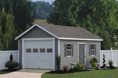 a gray garage with two windows on the side