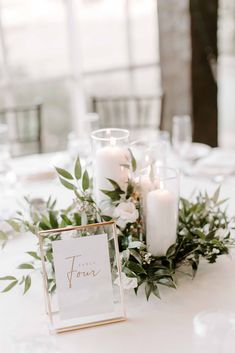 a table with candles and flowers on it