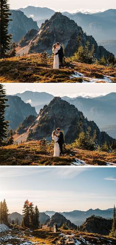 a couple standing on top of a mountain next to each other in front of mountains