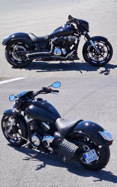 two motorcycles are parked on the side of the road in front of each other, one is black