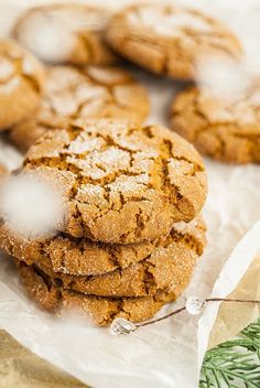 a pile of cookies sitting on top of a piece of wax paper