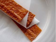 two pieces of food sitting on top of a white plate