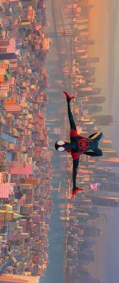 a spider man flying through the air over a city