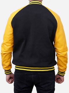 Wool Blended Black and Yellow Letterman Varsity Jacket For Men The jacket features a luxurious blend of high-quality wool fabric and supple leather sleeves. Also, this black and yellow varsity jacket ensures warmth and durability. Its front snap-tab button closure provides a secure and stylish fit. At the same time, the two front and inner pockets on this baseball men's jacket offer practical storage options. The primarily black design is tasteful, with vibrant yellow detailing, adding color to the overall aesthetic. Additionally, the leather varsity jacket is with rib cuffs, adding a worldly and stylish touch to the garment. Specifications: Made up of Wool Fabric with Leather Sleeves Front Snap-Tab Buttoned Closure Two Pockets on Front Two Inner Pockets Color: Black and Yellow Ribbed Cuff Black Varsity Jacket With Contrast Color For College, Black Varsity Jacket With Contrast Color, Casual Yellow Varsity Jacket For Fall, Black Varsity Jacket With Contrast Sleeves And Baseball Collar, Yellow Varsity Jacket For College In Fall, Black Varsity Jacket With Contrast Sleeves, Black Varsity Jacket With Contrast Collar For Streetwear, Black Sporty Varsity Jacket With Contrast Sleeves, Sporty Black Varsity Jacket With Contrast Sleeves