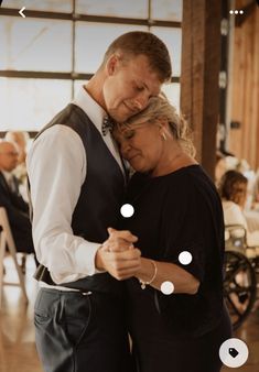 a man and woman dance together at a wedding