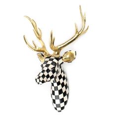 a black and white checkered deer head with gold antlers on it's back