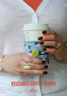 a woman holding a coffee cup in her hand with the words reusable coffee sleeve diy on it