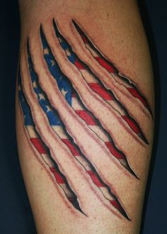 an american flag tattoo on the leg with claws sticking out of it's sides