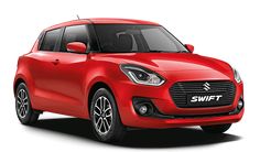 a red suzuki swift parked in front of a white background