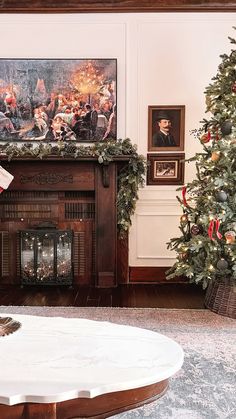 a living room decorated for christmas with stockings on the fireplace