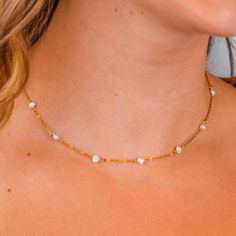 DAINTY PEARL STATION NECKLACE CHAIN ∙DETAILS Length: 16'' + 2'' extender / 40cm + 5cm extender Pearl width: 5mm ∙MATERIALS High-quality stainless steel, plated with 18k gold. ∙ ∙SHIPPING IMPORTANT: before placing an order, please double check that your address is correct to avoid any delays. Shop more one-of-a-kind pieces: https://www.etsy.com/shop/SeraphinJewelry Thank you so much for visiting and hope you enjoy shopping with us ♡ -Seraphine ♡ All images are copyrighted by IDOLAJEWELRY. All rig Dainty White Beaded Chain Necklace, Dainty Adjustable Pearl Necklace With Beaded Chain, Dainty Adjustable Beaded Pearl Necklace, Dainty Adjustable Pearl Chain Necklace, Adjustable Dainty Pearl Chain Necklace, Pearl Jewelry With Delicate Chain And Round Beads, Dainty Pearl White Beaded Chain Jewelry, Pearl White Dainty Beaded Chain Jewelry, Adjustable Pearl White Bridal Necklace With Pearl Chain