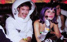 two people in costumes sitting next to each other