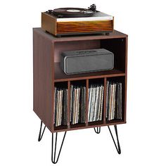 the record player is on top of a shelf