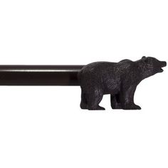 a black bear figurine sitting on top of a bar