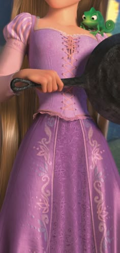 a girl in a purple dress holding a black cat