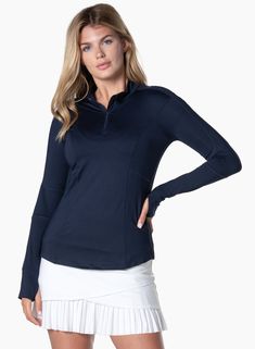 The perfect warmup for the athlete who really wants to bring some heat to the court or course. This 1/4 zip midnight long sleeve has side and underarm mesh inserts for maximum breathability, thumbholes for added coverage and UPF 50+ rating sun protection. All done in our performance jersey fabric with moisture-wicking that keeps you dry and cool. Navy Sporty Half-zip Top, Sporty Navy Half-zip Top, Fall Sports Half-zip Top, Half-zip Sports Top For Fall, Half-zip Sport Tops For Fall, Navy Athleisure Track Jacket With Long Sleeves, Technical Stretch Half-zip Tops, Athleisure Half-zip Top With Thumbholes, Navy Long Sleeve Athleisure Track Jacket