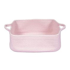 a pink knitted basket with handles on the bottom and sides, in front of a white background