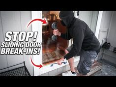 a man in a black hoodie is opening a door with the words stop sliding door break - ins