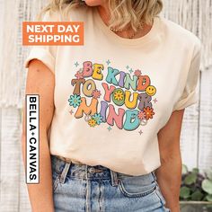 "Be Kind To Your Mind Shirt, Mental Health Gift, Inspirational Shirt, Mental Health Shirt, Therapist Shirt, Mental Health Awareness  Hi!  Welcome. It's great to see you here! ☺️ Our shirts are clean, high quality and soft. It is prepared quickly by our boutique.  Ironing and shipped.  Enjoy your shopping! It is a pleasure for us to help you with your questions and you can reach us at any time. Please, don't forget to check our size cards. HOW TO ORDER SHIRT 👕 Please, choose your favorite t-shirt color and size from the pop-up window. Select the quantity that you want. Click \"ADD TO CART\". You can go back to add more product color  for your loved ones members. You can complete the checkout process. Please \"Click Proceed to Check Out\" Finally, you have completed all the steps, your prod Multicolor Cotton Slogan Shirt, Multicolor Cotton Shirt With Slogan, Mental Health Shirts, Be Kind To Your Mind, School Psychologist, Inspirational Shirt, Be Kind To Yourself, Health Awareness, Mental Health Awareness